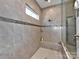 Large walk-in shower with tile surround and built-in seat at 11307 Miller Rd # 101, Pineville, NC 28134