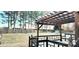 View of backyard, pergola, and fenced yard at 14021 Eldon Dr, Charlotte, NC 28277