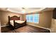 Bright bedroom with hardwood floors and large window at 14021 Eldon Dr, Charlotte, NC 28277