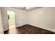 Bedroom with wood-look floors and access to bathroom at 14021 Eldon Dr, Charlotte, NC 28277