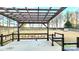 Covered patio with pergola, seating area, and fenced backyard at 14021 Eldon Dr, Charlotte, NC 28277