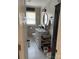 Modern bathroom with hexagon tile floor, shiplap walls, and white vanity at 1432 Poston Dr, Lincolnton, NC 28092