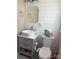 Clean bathroom with gray vanity and white shiplap walls at 1432 Poston Dr, Lincolnton, NC 28092