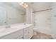 Bathroom with double vanity and tub shower combo at 1878 Sapphire Meadow Dr, Fort Mill, SC 29715