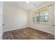 Bright bedroom with wood-look floors and window at 1878 Sapphire Meadow Dr, Fort Mill, SC 29715