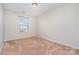 Bedroom with neutral carpet and large window at 1878 Sapphire Meadow Dr, Fort Mill, SC 29715