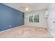 Bedroom with blue accent wall and ceiling fan at 1878 Sapphire Meadow Dr, Fort Mill, SC 29715