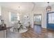 Bright dining room features a table with four chairs, hardwood floors, and access to other rooms at 1878 Sapphire Meadow Dr, Fort Mill, SC 29715