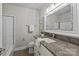 Updated bathroom with granite countertop, tile shower, and a white vanity at 2008 Townsend Ave, Charlotte, NC 28205