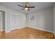 Spacious bedroom with hardwood floors and double doors leading to the closet at 2008 Townsend Ave, Charlotte, NC 28205