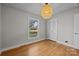 Bright bedroom with hardwood floors and spacious closet at 2008 Townsend Ave, Charlotte, NC 28205