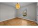 Well-lit bedroom with hardwood floors and a large window at 2008 Townsend Ave, Charlotte, NC 28205