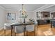 Elegant dining room with a chandelier and view of kitchen at 2008 Townsend Ave, Charlotte, NC 28205