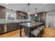 Modern kitchen with granite island, stainless steel appliances, and dark cabinetry at 2008 Townsend Ave, Charlotte, NC 28205