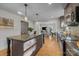 Eat-in kitchen boasts updated cabinets and a view into the dining area at 2008 Townsend Ave, Charlotte, NC 28205