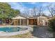 Kidney-shaped pool with concrete decking at 2008 Townsend Ave, Charlotte, NC 28205