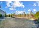 Large backyard with fenced in area and wooded area at 3001 Burton Point Ct, Waxhaw, NC 28173