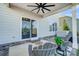 Covered patio with seating area and sliding glass door at 3001 Burton Point Ct, Waxhaw, NC 28173