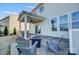 Covered patio with seating area and fire pit at 3001 Burton Point Ct, Waxhaw, NC 28173