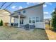 Covered patio with seating area, fire pit, and grilling space at 3001 Burton Point Ct, Waxhaw, NC 28173