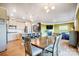 Kitchen and dining area with hardwood floors and modern lighting at 3001 Burton Point Ct, Waxhaw, NC 28173