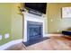 Modern white fireplace with dark hearth in a corner living room at 3001 Burton Point Ct, Waxhaw, NC 28173