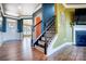 Modern staircase with black spindles and wood treads at 3001 Burton Point Ct, Waxhaw, NC 28173