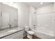 Bathroom with granite countertop, bathtub, and toilet at 3118 Amay James Ave, Charlotte, NC 28208