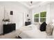 Bright bedroom with a large window and cozy bedding at 3118 Amay James Ave, Charlotte, NC 28208