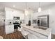 Spacious kitchen featuring white cabinets, granite countertops, and stainless steel appliances at 3118 Amay James Ave, Charlotte, NC 28208