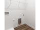 Clean laundry room with built-in shelving and flooring at 3118 Amay James Ave, Charlotte, NC 28208