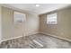 Bedroom with two windows and wood-look floors at 3524 Lancaster Hwy, Monroe, NC 28112