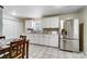 Modern kitchen featuring white cabinets, stainless steel appliances, and tile floors at 3524 Lancaster Hwy, Monroe, NC 28112