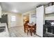 Eat-in kitchen with white cabinets and a stainless steel refrigerator at 3524 Lancaster Hwy, Monroe, NC 28112