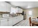 Well-equipped kitchen with white cabinets and stainless steel appliances at 3524 Lancaster Hwy, Monroe, NC 28112