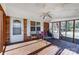 Relaxing screened porch with ceiling fan and seating at 3524 Lancaster Hwy, Monroe, NC 28112