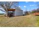 Gray storage shed with additional covered storage area at 3524 Lancaster Hwy, Monroe, NC 28112