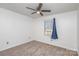 Bright bedroom with neutral walls and carpet at 410 E Louisiana Ave # 2, Bessemer City, NC 28016