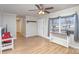 Living room with hardwood floors, a ceiling fan, and a view of the hallway at 410 E Louisiana Ave # 2, Bessemer City, NC 28016