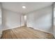 Neutral bedroom with hardwood floors and access to ensuite bathroom at 4328 Hancock Ter, Charlotte, NC 28205