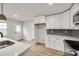 Kitchen with white cabinets, quartz counters, and stainless steel appliances at 4328 Hancock Ter, Charlotte, NC 28205