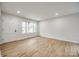 Bright living room with hardwood floors and large window at 4328 Hancock Ter, Charlotte, NC 28205