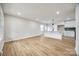 Open-concept living area with hardwood floors connecting to modern kitchen at 4328 Hancock Ter, Charlotte, NC 28205