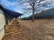 Side view of the home showcasing the porch and yard at 4766 Dolph Monroe Rd, Maiden, NC 28650