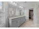 Elegant bathroom featuring double sinks, granite countertop, large mirrors and a walk-in closet at 620 Altamonte Dr, Clover, SC 29710