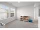 A room with a storage shelf and toy piano near bright, natural light from a set of large windows at 620 Altamonte Dr, Clover, SC 29710