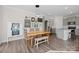 Dining area with a wooden table, natural lighting, and modern pendant lights at 620 Altamonte Dr, Clover, SC 29710