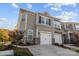 Beautiful townhome showcases a two-car garage and manicured landscaping, enhancing its curb appeal at 620 Altamonte Dr, Clover, SC 29710