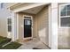 The home's front entrance featuring a modern door with glass accents and a welcoming doormat at 620 Altamonte Dr, Clover, SC 29710