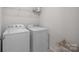 Practical laundry room with washer, dryer, and shelf at 620 Altamonte Dr, Clover, SC 29710